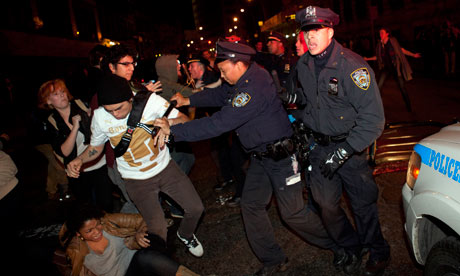 Protesters clash with police near Zuccotti Park as they are forced to leave their camp. (photo: John Minchillo/AP)